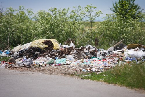 Investigator reviewing waste transfer notes and records in an office